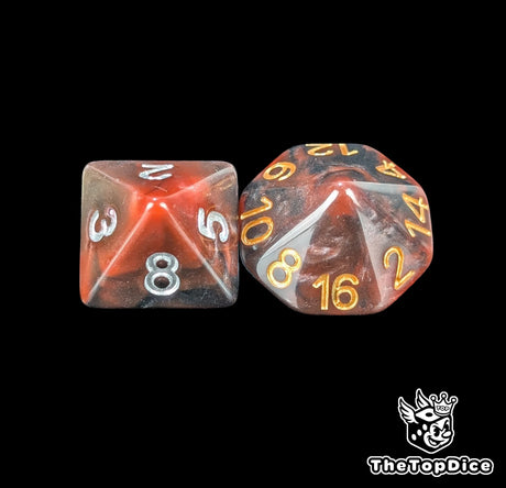 Close up of a red and black D8 and D16 with silver numbers for scatter and long range rolls