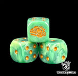 Three jade Seraphon dice with gold pips and a gold chameleon head