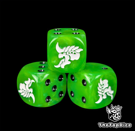 Close up of a green 16mm resin D6 die engraved with a white hive alien head and black pips