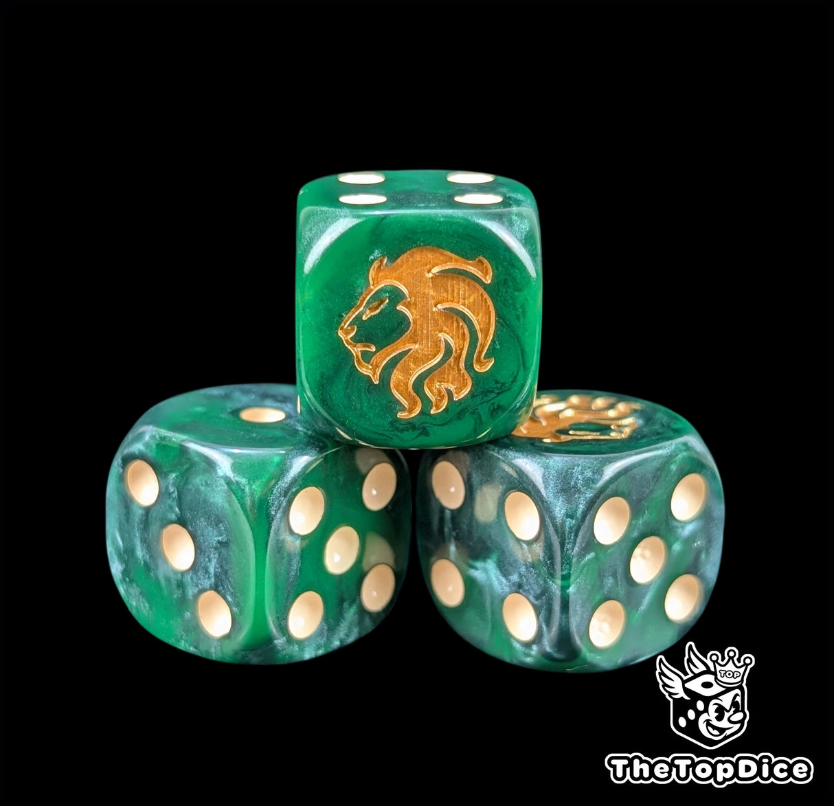 Close up of a dark green 16mm resin D6 die engraved with a gold lion head and beige pips