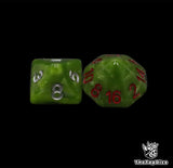 Close up of a green D8 and D16 with silver numbers for scatter and long range rolls