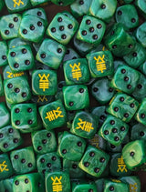 Pile of green scorpion 16mm D6 dice for a sci-fi alien army