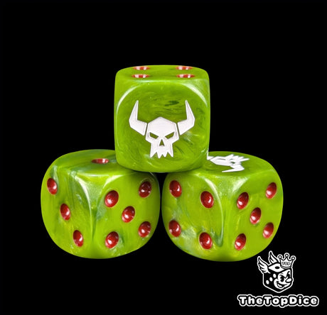 Close up of a green 16mm resin D6 die engraved with a white orc skull and red pips