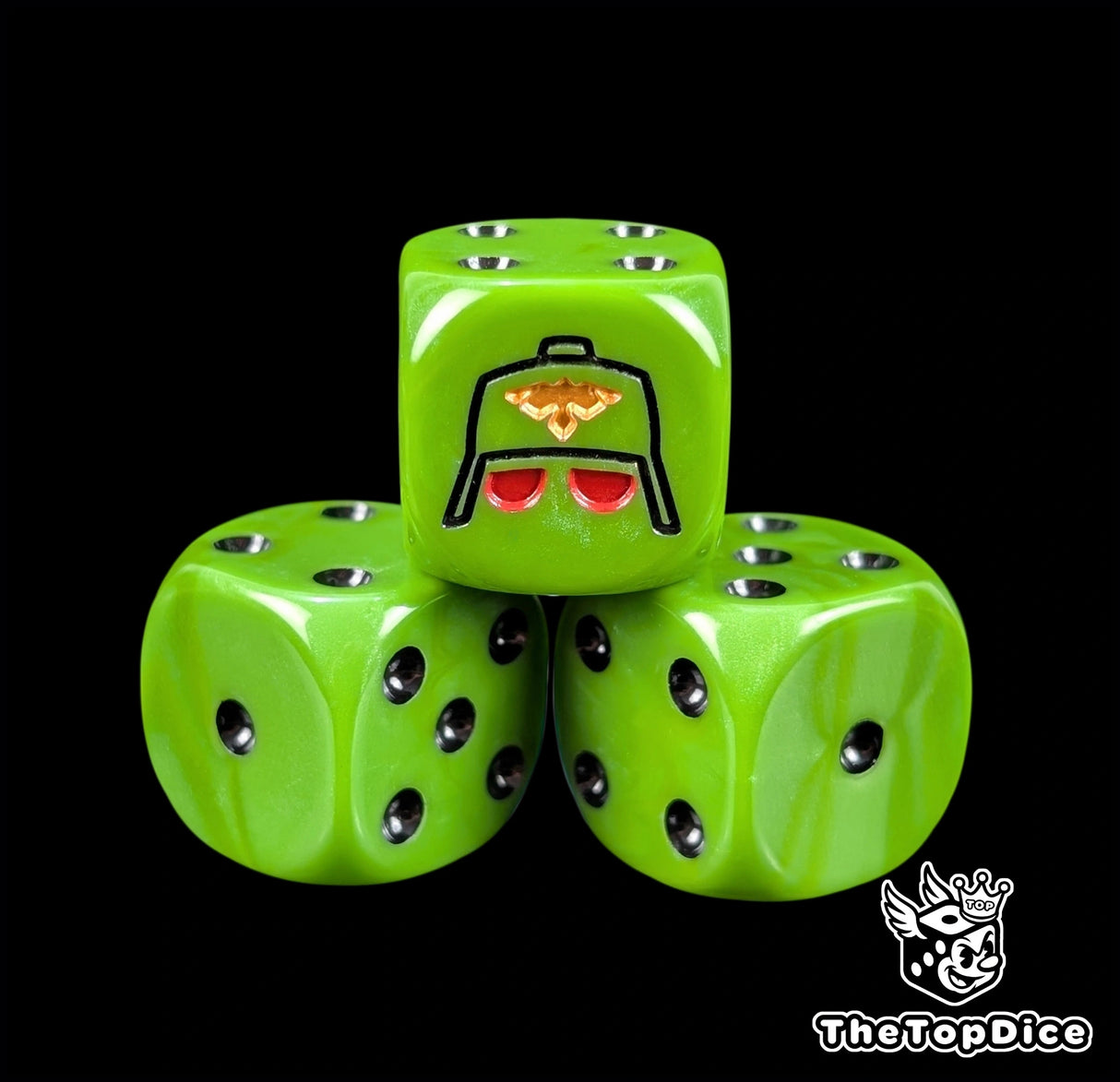 Close up of a green 16mm resin D6 die engraved with a black gas mask helm and gold eagle and black pips