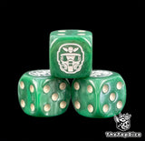 Three green kill team dice with a white Kasrkin helm on top