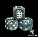 Close-up of a green D6 die with a white grenade emblem