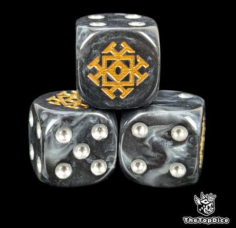 Close up of a grey and black 16mm resin D6 die engraved with a gold throne rune and silver pips
