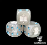 Close up of a grey 16mm resin D6 die engraved with a white tome and sword and blue pips