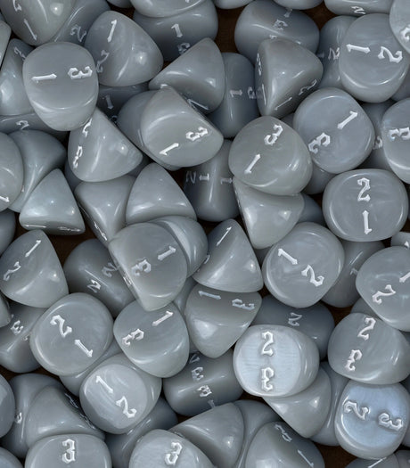 Neutral grey three sided dice loaded into a tray as objective markers