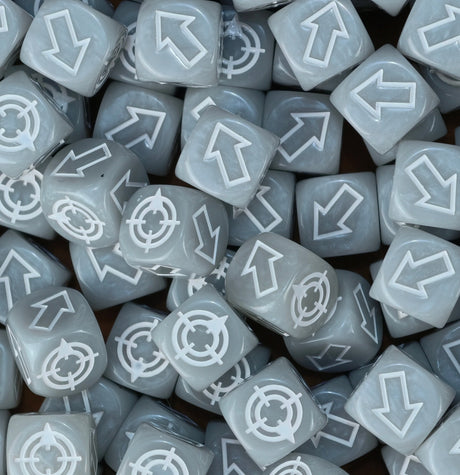 Grey and white scatter dice in a tray, matched to the ash waste boards of Necromunda