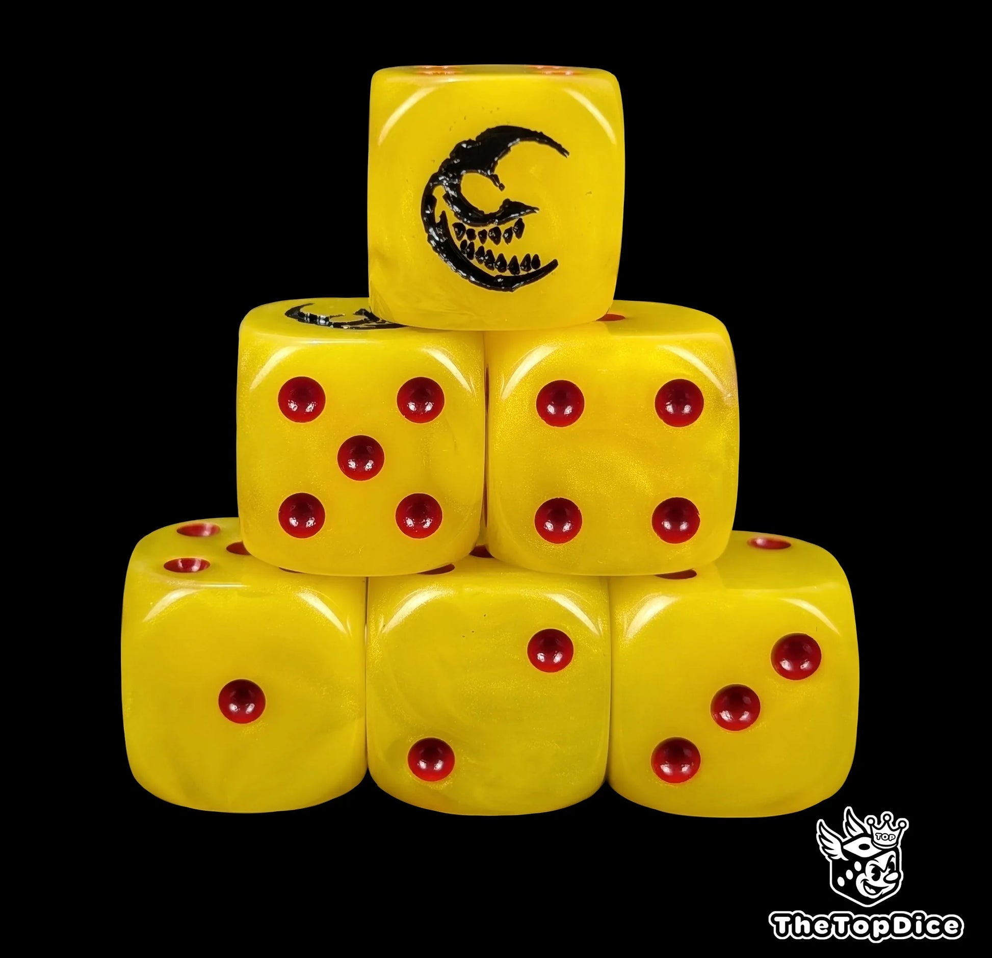 Yellow 16mm D6 dice with a black grinning moon emblem and red pips for fantasy wargaming