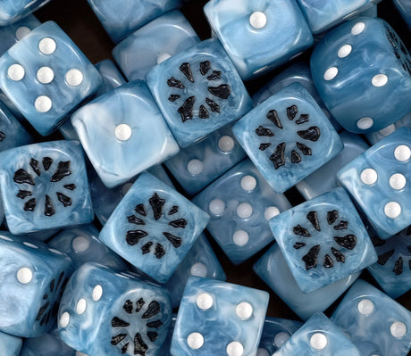 A pile of ice blue Ogor D6 with pearl pips and black bite marks