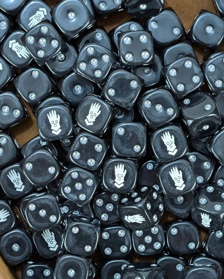 Pile of black iron fist 16mm D6 dice for a sci-fi cybernetic army