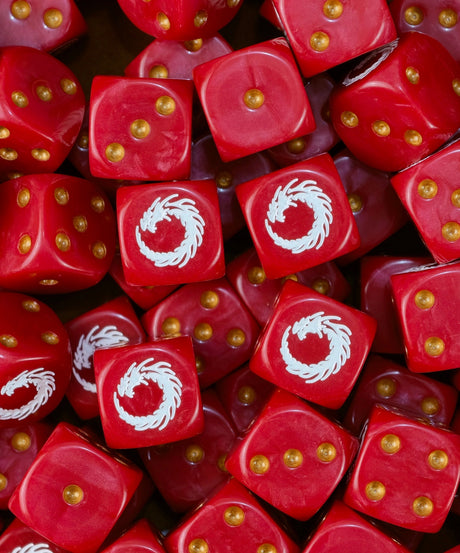 Pile of red XV Legion dice with gold pips and white coiled dragons