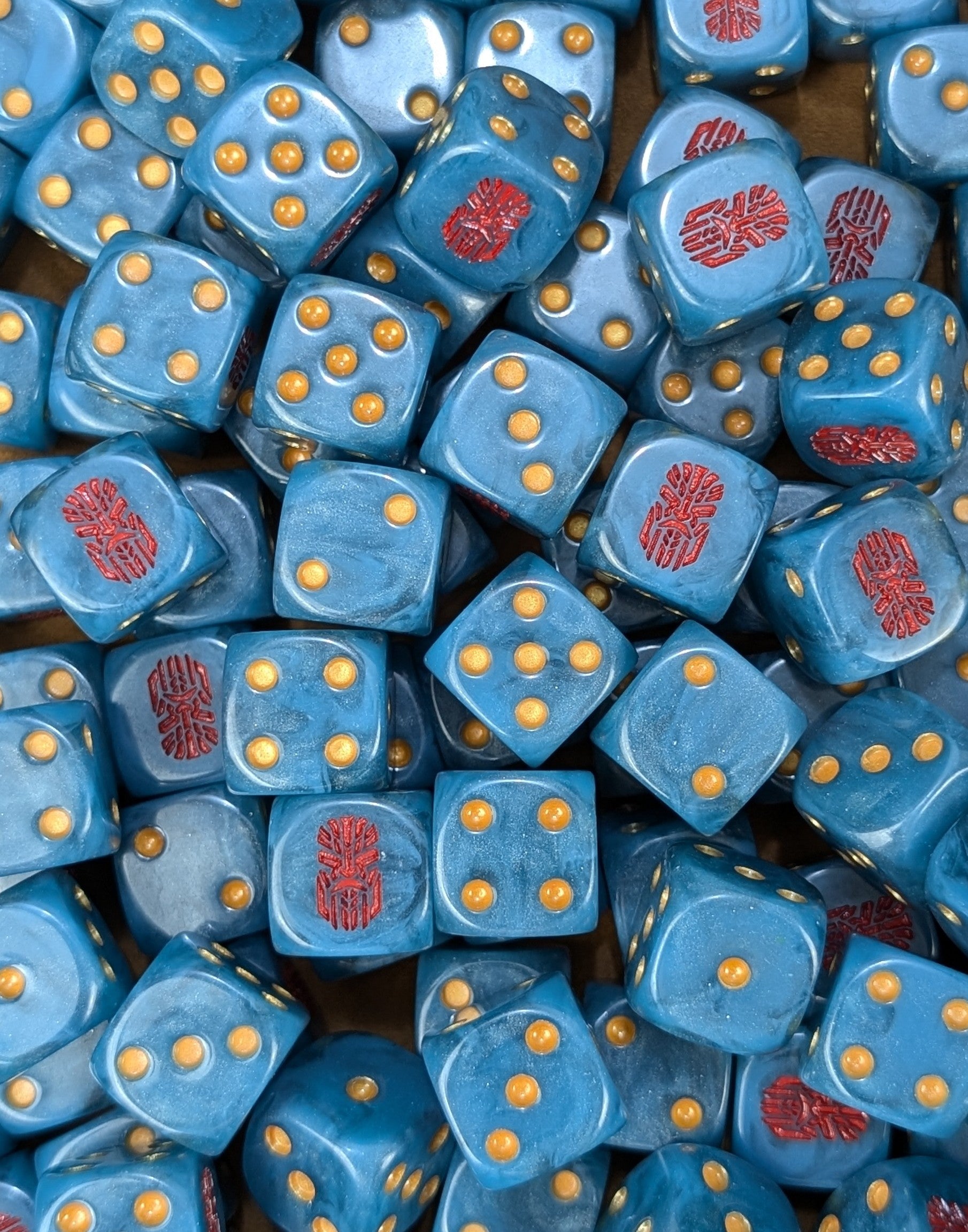 Custom blue, red and gold dice for Warhammer Votann forces