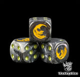 Three black 16mm Gloomspite Gitz D6, the yellow mad moon facing front beside olive pips