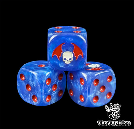 Close up of a midnight blue 16mm resin D6 die engraved with a white winged skull and red pips