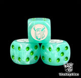 Three mint green Sylvaneth dice with a white antlered tree spirit