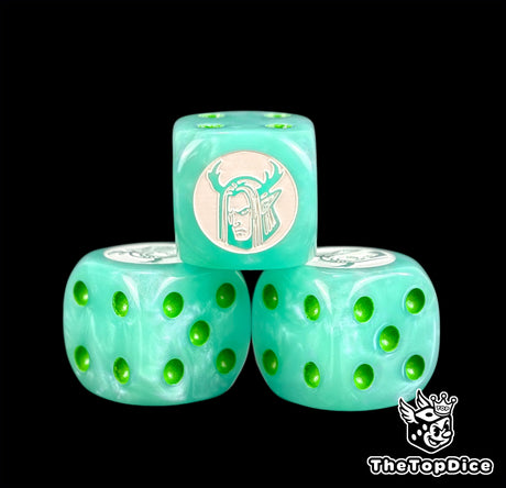 Three mint green Sylvaneth dice with a white antlered tree spirit