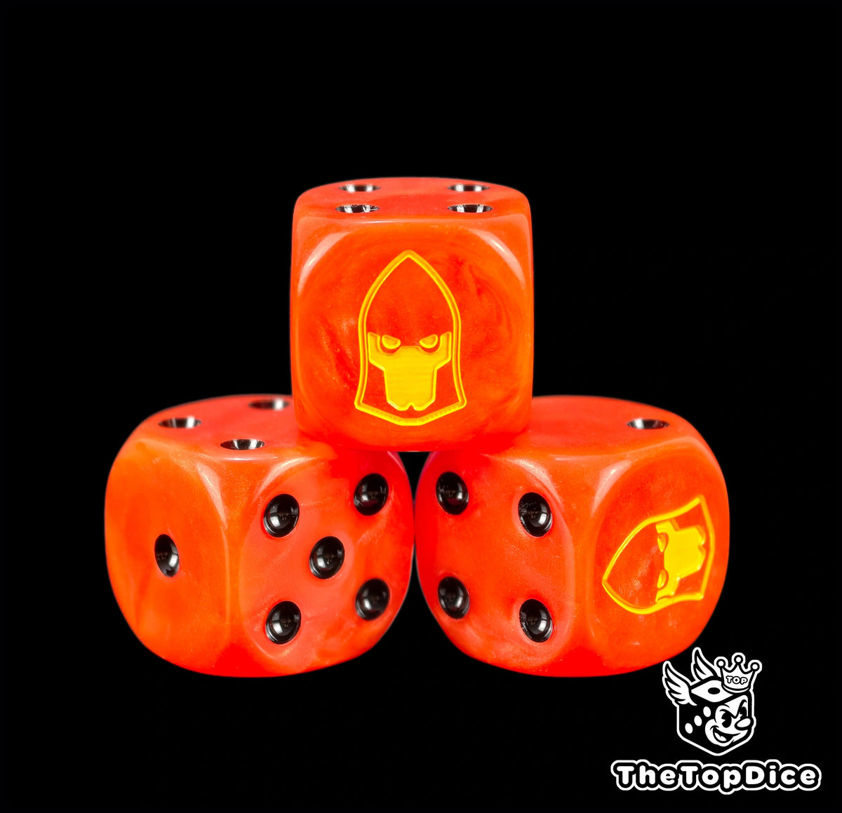 Three Fire Dragon dice in burning orange resin with black pips