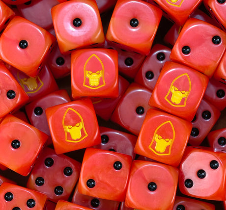 A pile of orange Fire Dragons dice with yellow Aeldari aspect helms