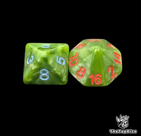 Close up of a green D8 and D16 with blue numbers for scatter and long range rolls