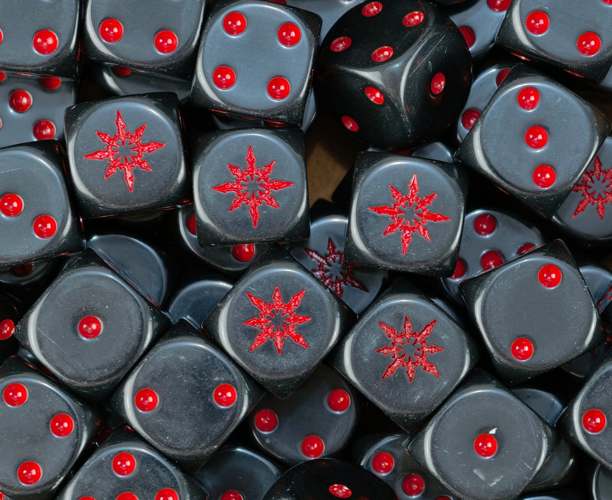 Pile of black chaos star dice with red stars and red pips for a Chaos Space Marines army