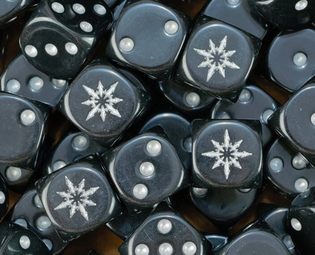 Pile of black chaos star dice with silver stars and silver pips for a Black Legion warband