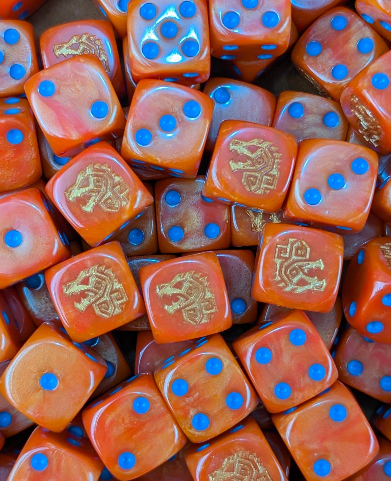 Pile of orange dino rune 16mm D6 dice for a fantasy lizardmen army