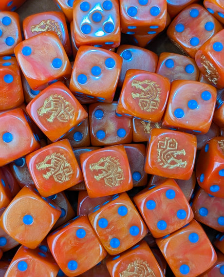 Pile of orange dino rune 16mm D6 dice for a fantasy lizardmen army