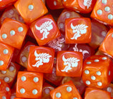 A pile of orange Tyranid hive fleet dice with white pips and alien heads