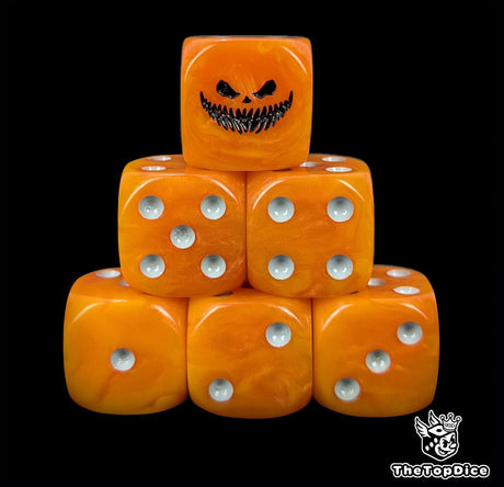 Close up of two orange D6 with a black pumpkin grin logo on the six face for fantasy football