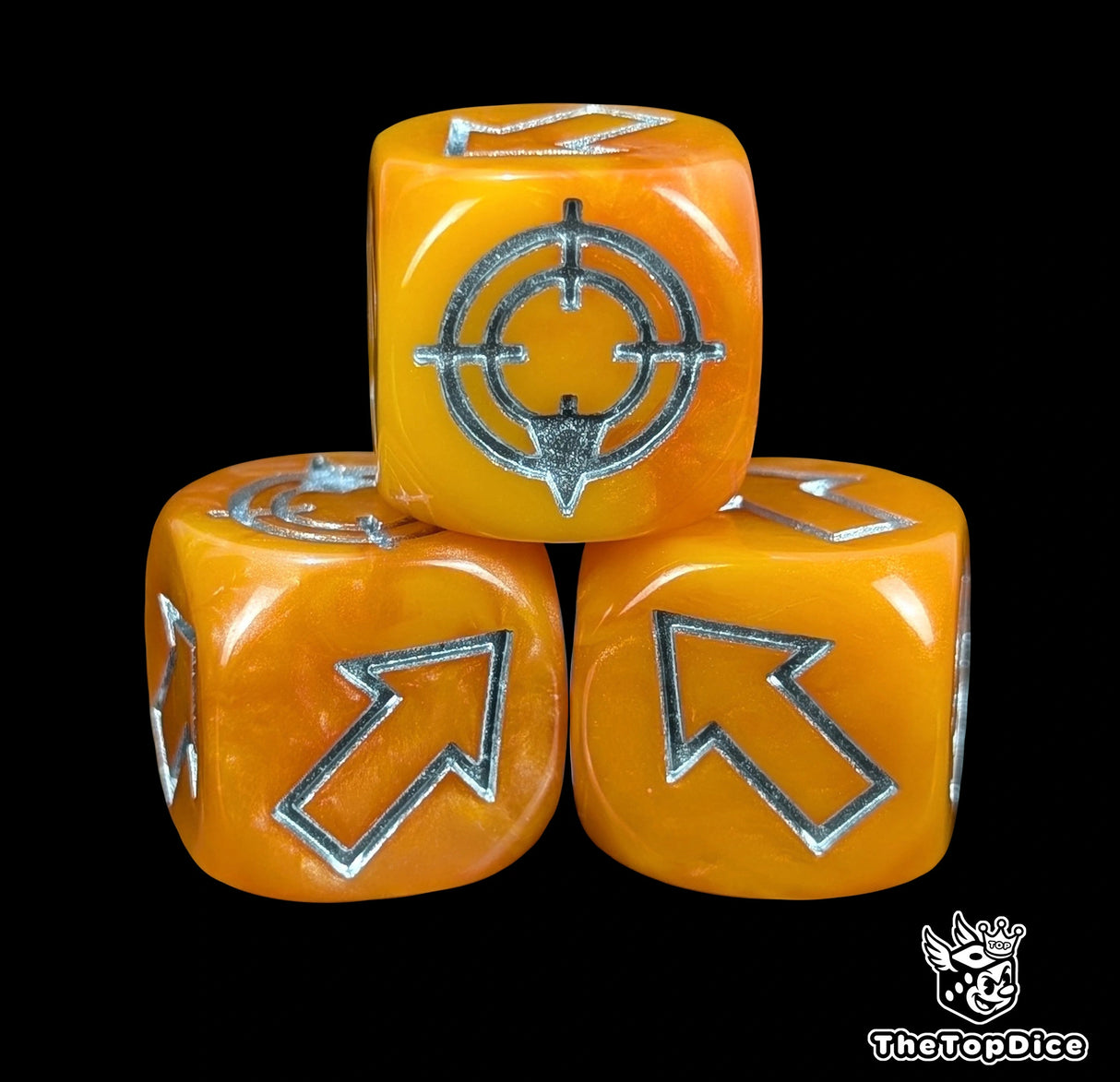 Close up of an orange resin scatter die showing the silver direction arrows