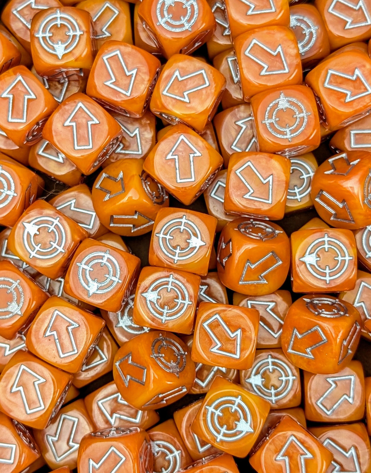 Pile of orange scatter dice for tabletop battles
