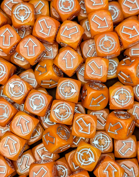Pile of orange scatter dice for tabletop battles