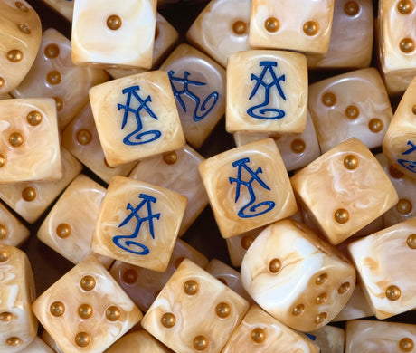 A pile of peach high elf dice, blue runes and gold pips repeating