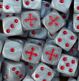 A pile of pearl white Badab War dice, red crosses and red pips repeating