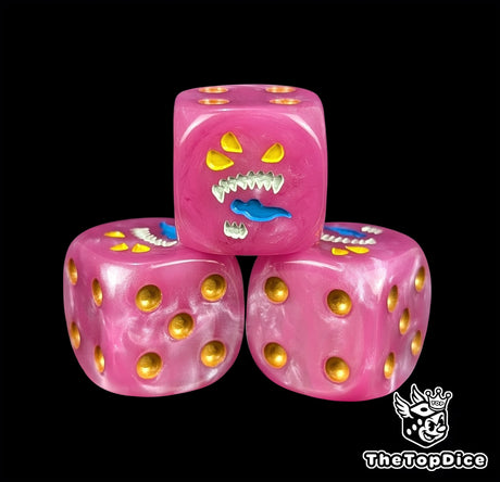 Close up of a pink 16mm resin D6 die engraved with a three eyed daemon face and gold pips