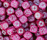 Strawberry pink scatter dice heaped in a tray, a colour nobody else brings to the table