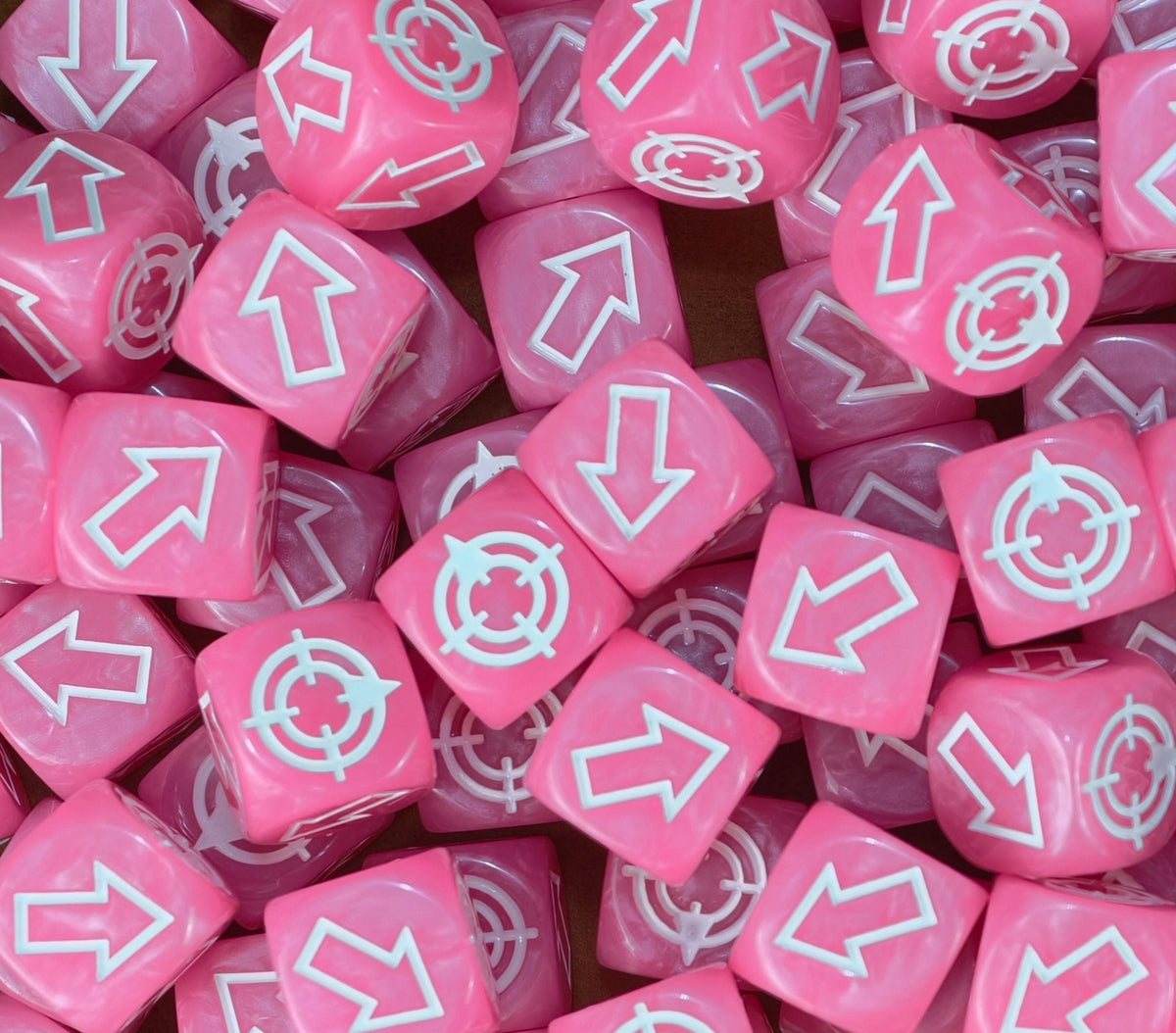 Pink scatter dice by the handful, the easy ones to spot when one rolls off the board