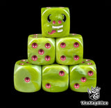 Green 16mm D6 dice with a grinning imp face and purple pips for fantasy wargaming