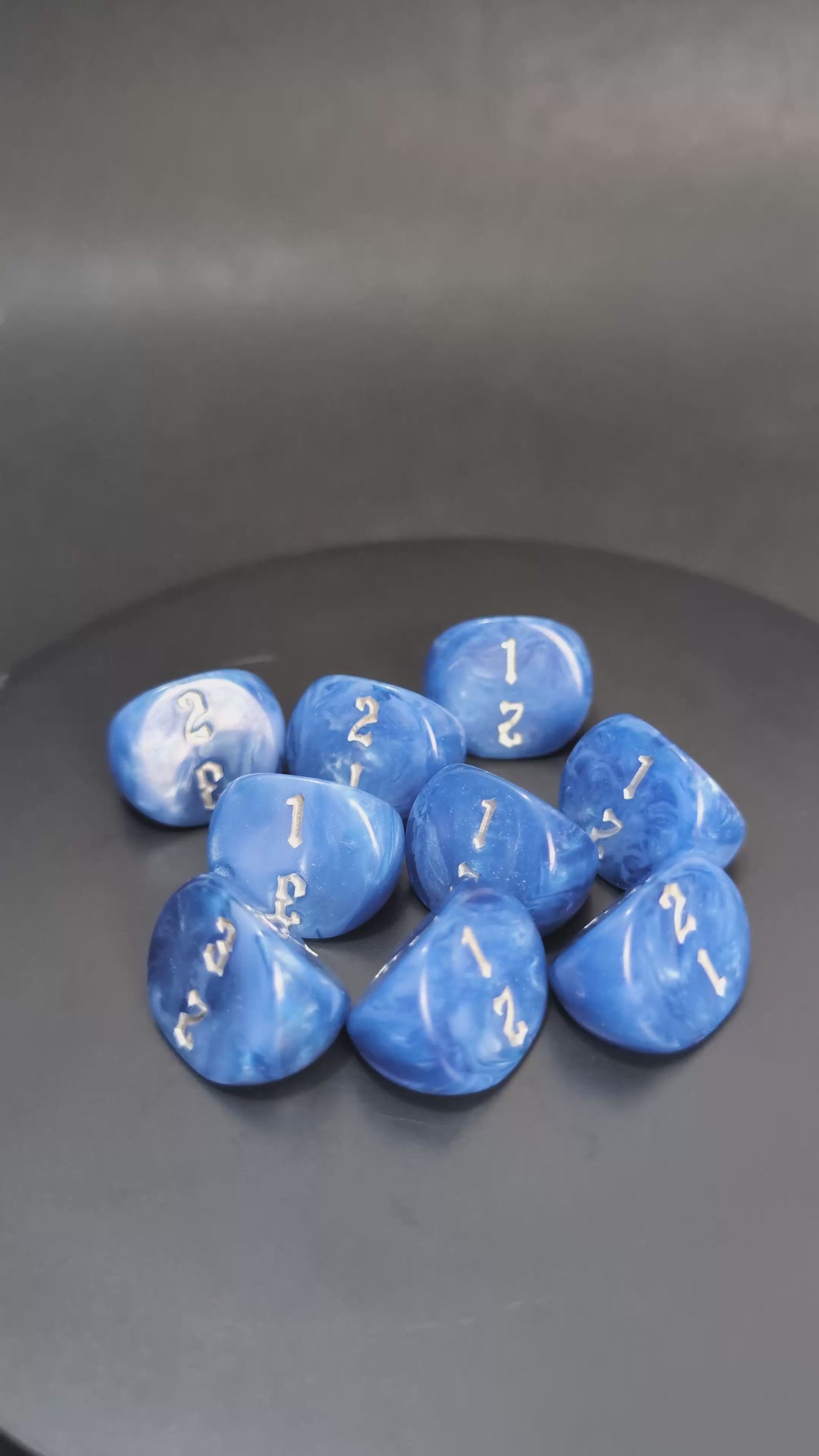 Blue and silver D3 resin dice with engraved numbers