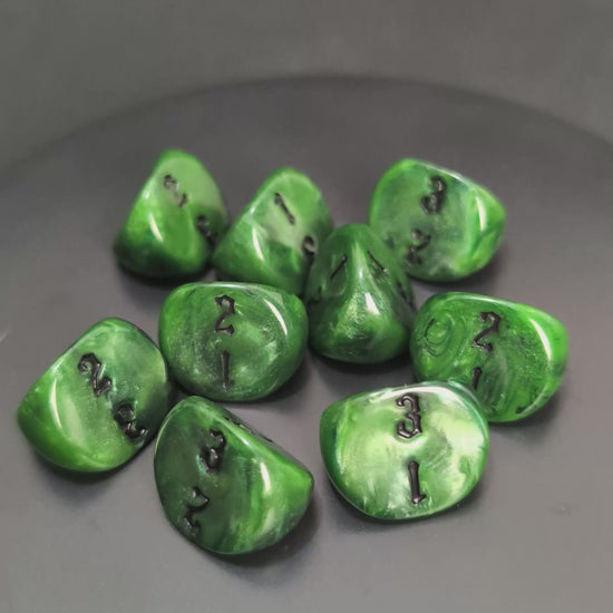 Green and black D3 resin dice with engraved numbers
