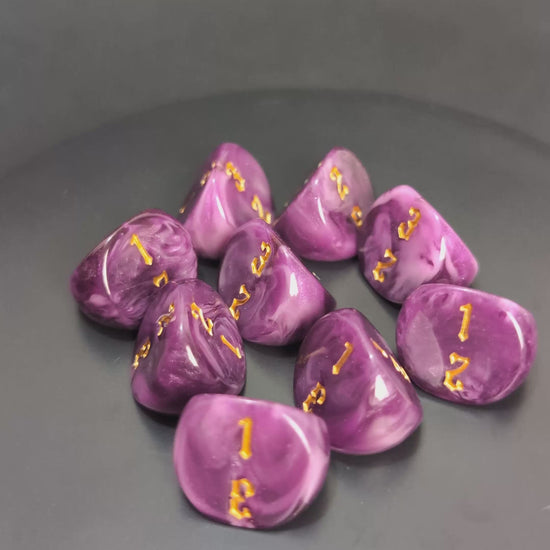 Purple and gold D3 resin dice with engraved faces