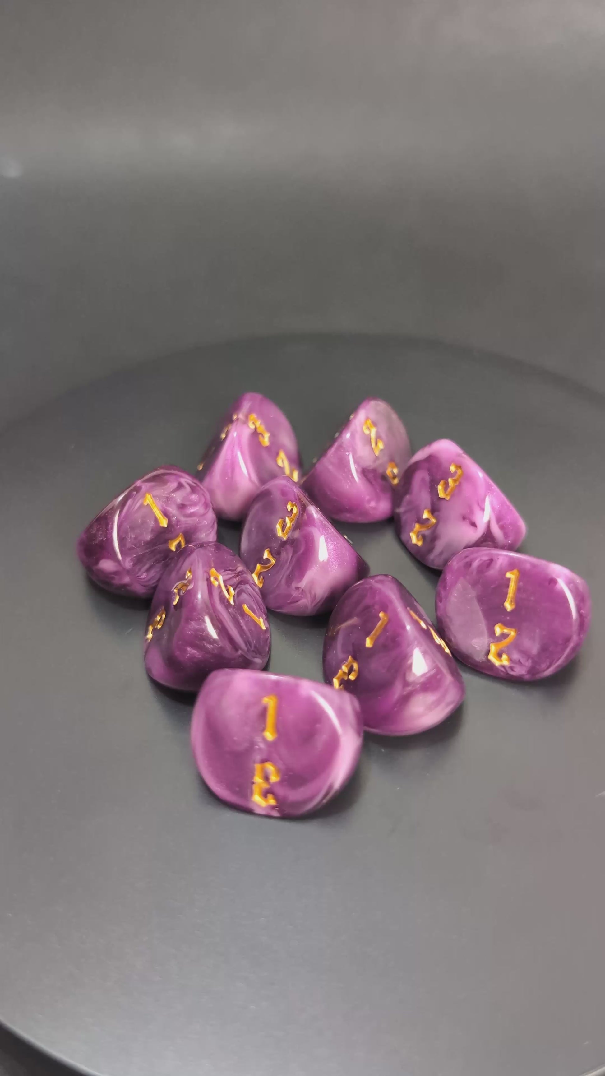 Purple and gold D3 resin dice with engraved faces
