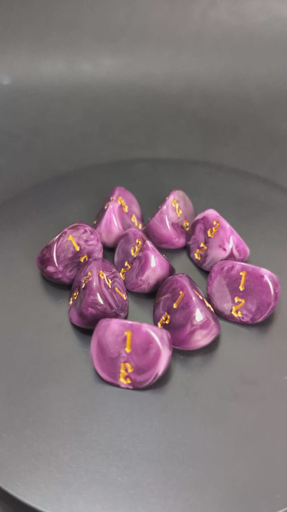 Purple and gold D3 resin dice with engraved faces