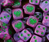 A pile of purple Cthulhu D6 with green pips and tentacled heads