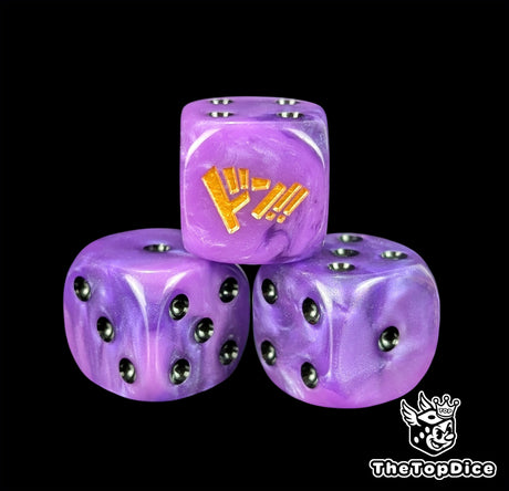 Close up of a purple 16mm resin D6 die engraved with black pips and a gold emblem as a TCG power counter