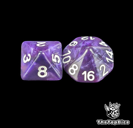 Close up of a purple D8 and D16 with white numbers for scatter and long range fantasy football rolls