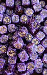 Pile of purple and pink scatter dice for tabletop battles